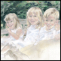 Portrait of sisters and brother in pastel